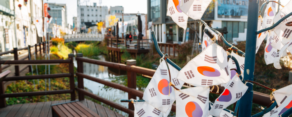 South Korean flags next to a canal