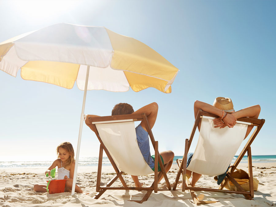 Family relaxing on the beach