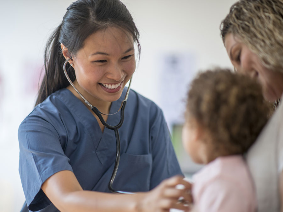 Doctor checking patients heart